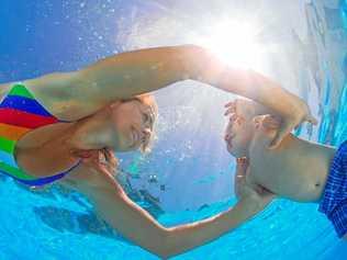 Region MPs Tony Perrett and Deb Frecklington have thrown their weight behind the school swim safety campaign. Picture: Denis Moskvinov