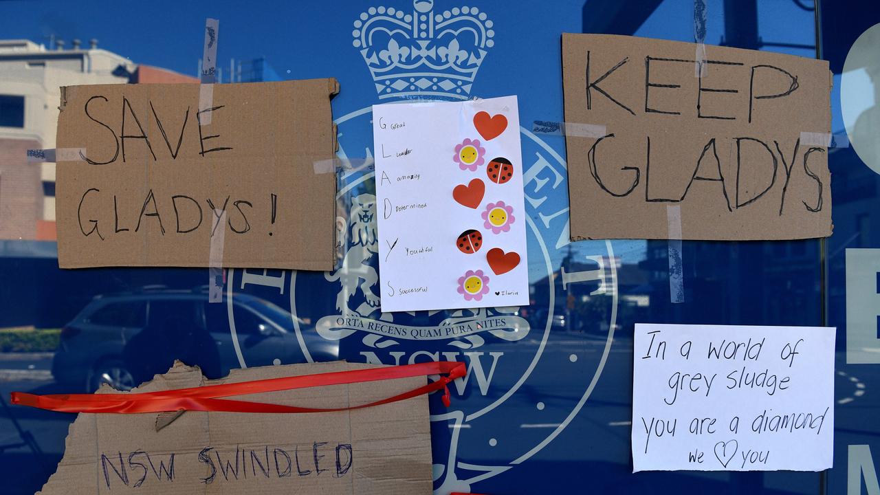 Flowers and signage are left at the front of the office of Premier Gladys Berejiklian after her resignation, in Sydney. Picture: NCA NewsWire/Bianca De Marchi