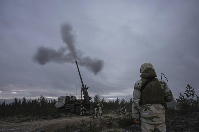 French soldiers operate a CAESAR howitzer during NATO exercises in Lapland