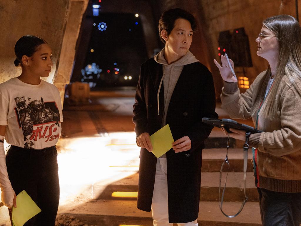 Amandla Stenberg, Lee Jung-jae and Director Leslye Headland on the set of The Acolyte. .