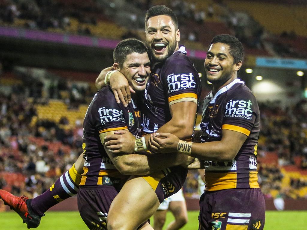 Alex Glenn (centre) celebrates scoring a try with teammates Matt Gillett (left) and Anthony Milford (right) in 2017. Picture: AAP Image/Glenn Hunt