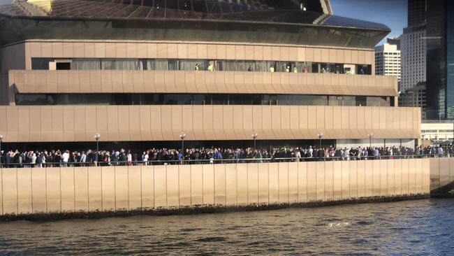 Crowds gather on the Sydney Opera House to watch final Qantas jumbo 747 fly by. Picture: John Hartley