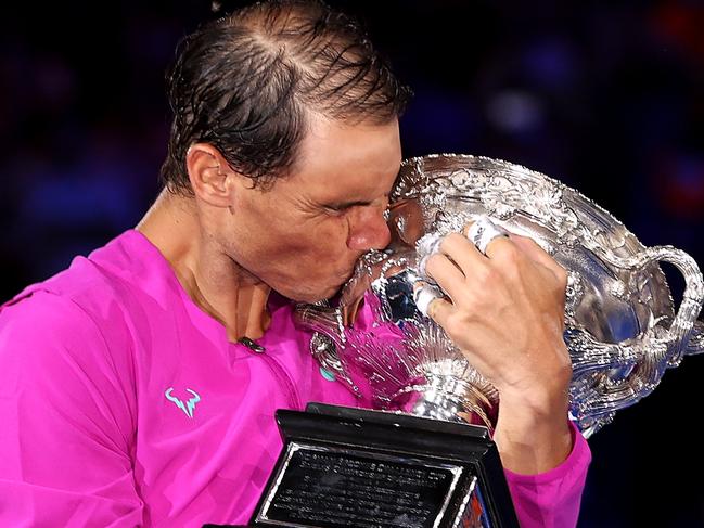 MELBOURNE, AUSTRALIA - JANUARY 30: Rafael Nadal of Spain kisses the Norman Brookes Challenge Cup as he celebrates victory in his MenÃ¢â¬â¢s Singles Final match against Daniil Medvedev of Russia during day 14 of the 2022 Australian Open at Melbourne Park on January 30, 2022 in Melbourne, Australia. (Photo by Clive Brunskill/Getty Images) *** BESTPIX ***