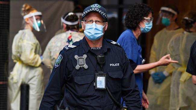 A police officer stationed outside the Peppers Waymouth Hotel in Adelaide. Picture: Brenton Edwards