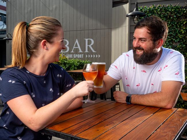 Hotel Darwin owners Penny Phillips and Brett Lubicz share a drink in celebration of their reopening in Darwin yesterday. Picture: Che Chorley