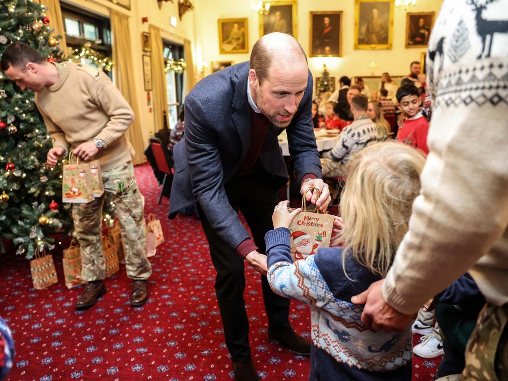 William handed out gifts to the children of military personnel. Picture: AFP