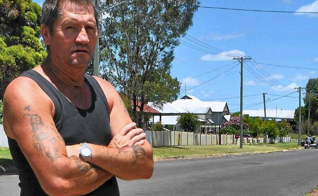 Guy Harvey surveys the hoon track marks left out the front of his Fitzroy St residence.