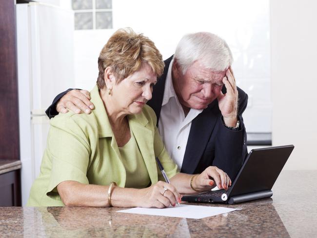 senior couple worrying about money