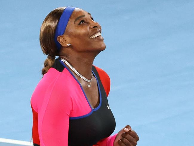 TOPSHOT - Serena Williams of the US celebrates beating Romania's Simona Halep during their women's singles quarter-final match on day nine of the Australian Open tennis tournament in Melbourne on February 16, 2021. (Photo by David Gray / AFP) / -- IMAGE RESTRICTED TO EDITORIAL USE - STRICTLY NO COMMERCIAL USE --