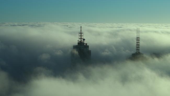 A thick fog hangs over Melbourne hiding the buildings. Picture: David Crosling