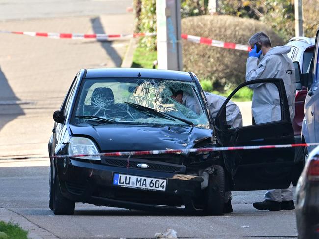 Forensic officers examine a damaged car at the site of a car ramming attack in Mannheim, southwestern Germany on March 3, 2025. Picture: AFP