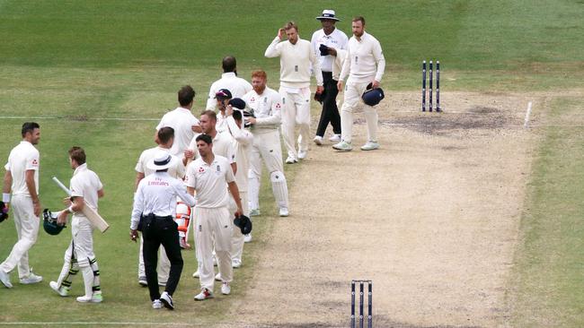 Players shake hands as the match was called a draw late on day five of the Boxing Day test match between Australia and England at the MCG in Melbourne, Saturday, December 30, 2017. (AAP Image/George Salpigtidis) NO ARCHIVING, EDITORIAL USE ONLY, IMAGES TO BE USED FOR NEWS REPORTING PURPOSES ONLY, NO COMMERCIAL USE WHATSOEVER, NO USE IN BOOKS WITHOUT PRIOR WRITTEN CONSENT FROM AAP