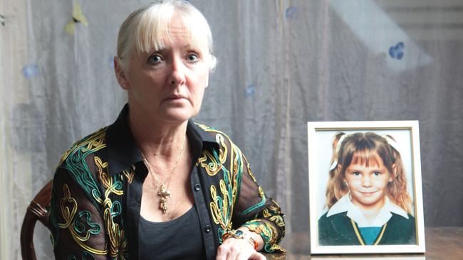 Cecily Johnson with a picture of her deceased daughter Laine Bradley. Picture: Russell Shakespeare 