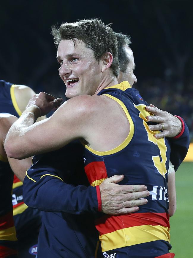 Matt Crouch hugs coach Don Pyke after the stunning win Picture: Sarah Reed