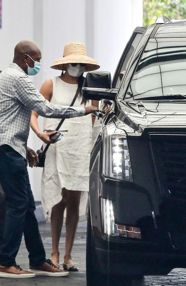 Meghan was pictured hopping into her black Cadillac. Picture: Javiles Bruce/BACKGRID