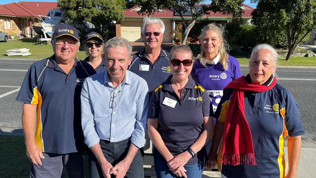 Members of Yamba Rotary celebrate with Kevin Hogan after the announcement of grant funding to go towards a new bus stop.