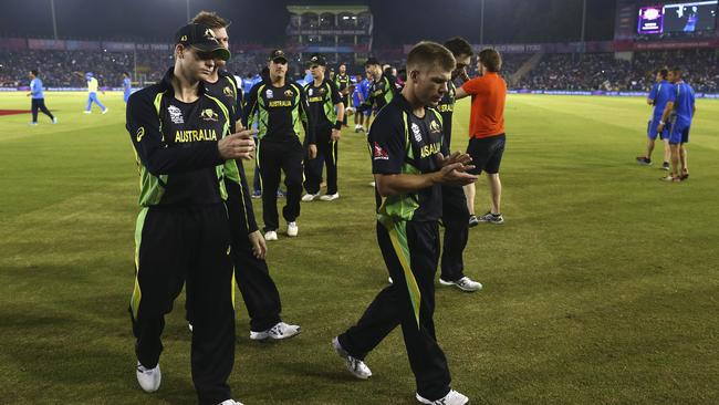 Steve Smith (L) and David Warner (R) walk off after Australia was eliminated from the World T20.