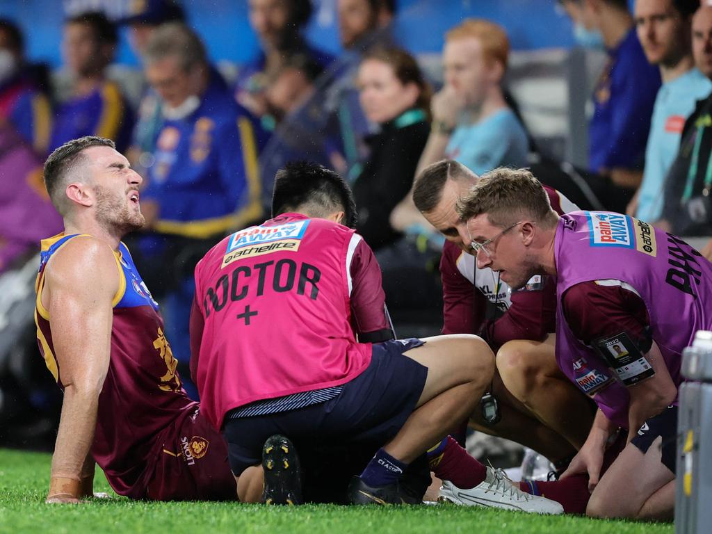 Medical staff work on Dan McStay’s injured ankle. Picture: Russell Freeman/AFL Photos via Getty Images