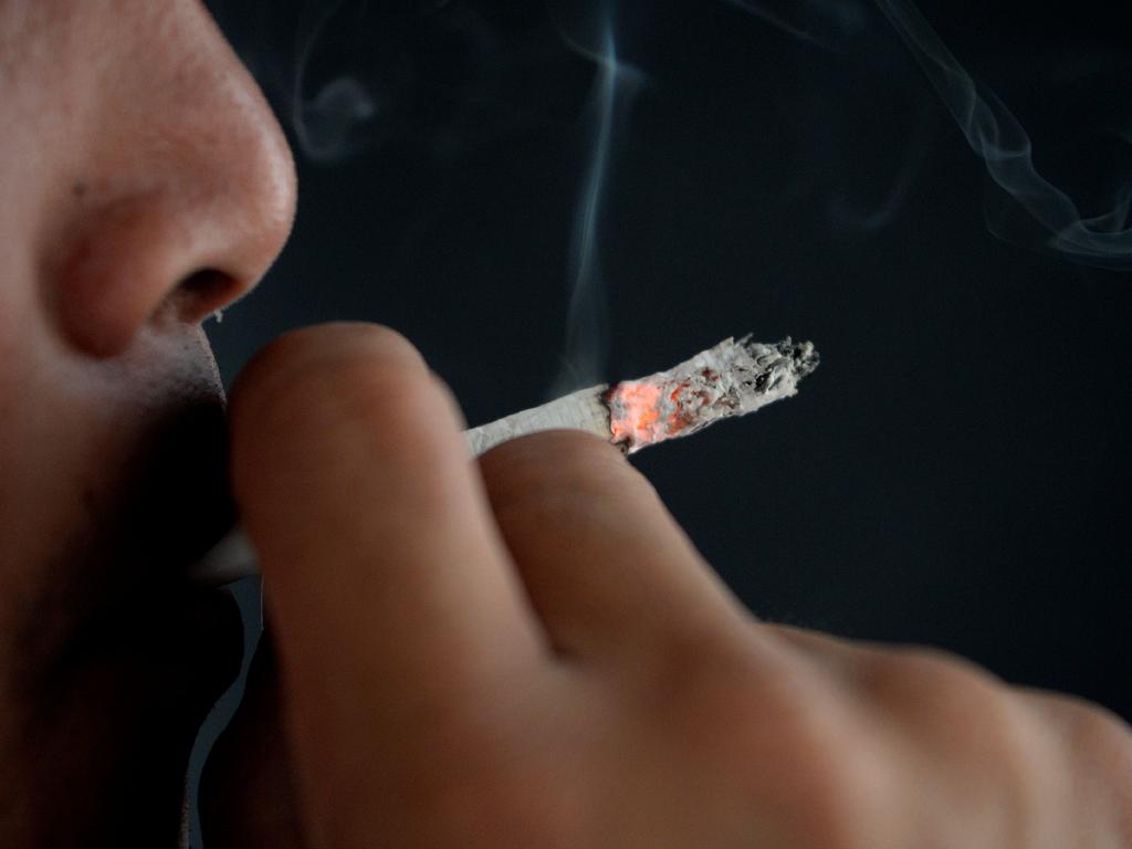 A man smokes a cigarette in Manila. Picture: Noel Celis/AFP