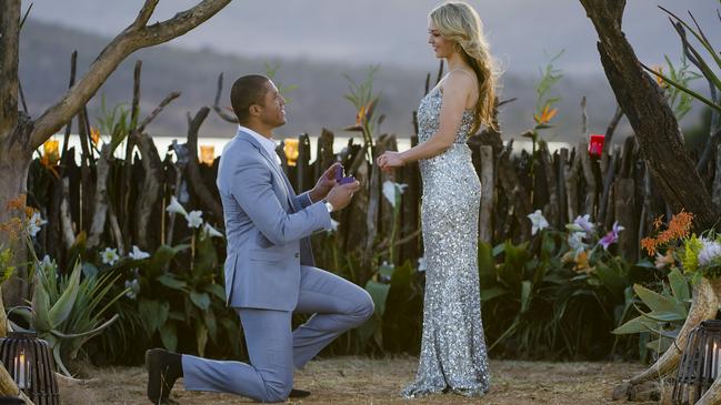 Proposal... . Bachelo Blake Garvey and Sam Frost on reality TV set.