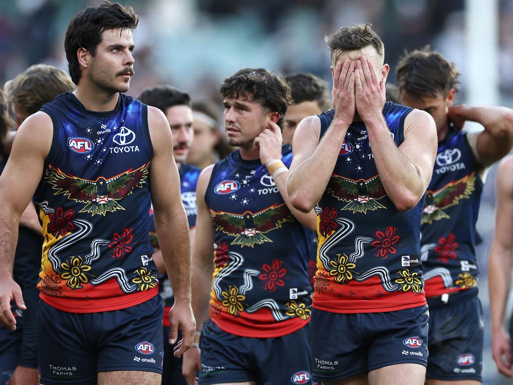 MELBOURNE, AUSTRALIA - MAY 18: Darcy Fogarty and his Crows team mates look dejected after losing the round 10 AFL match between Collingwood Magpies and Kuwarna (the Adelaide Crows) at Melbourne Cricket Ground, on May 18, 2024, in Melbourne, Australia. (Photo by Quinn Rooney/Getty Images)