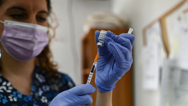 A medical staff member prepares a dose of Pfizer/BioNTech vaccine. Picture: ARIS MESSINIS / AFP