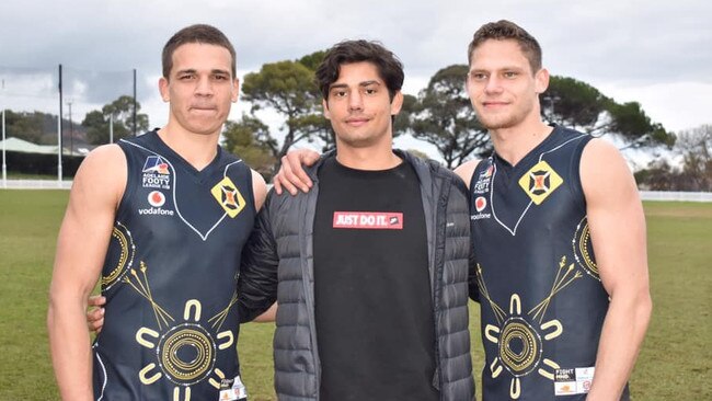 Scotch Old Collegians footballer Jy Farrar (right) with teammate Ash Johnson (left) in the club’s indigenous round guernseys along with Adelaide Crows and former Scotch player Shane McAdam (centre). Farrar has been invited to the state draft combine.