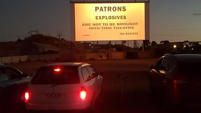 Only in the outback … the unique notice traditionally flashed to patrons at the drive-in theatre in the mining town Coober Pedy. Random explosions are no longer common, but the slide is being digitised to return as a piece of permanent history. Picture: Coober Pedy Drive-in Theatre