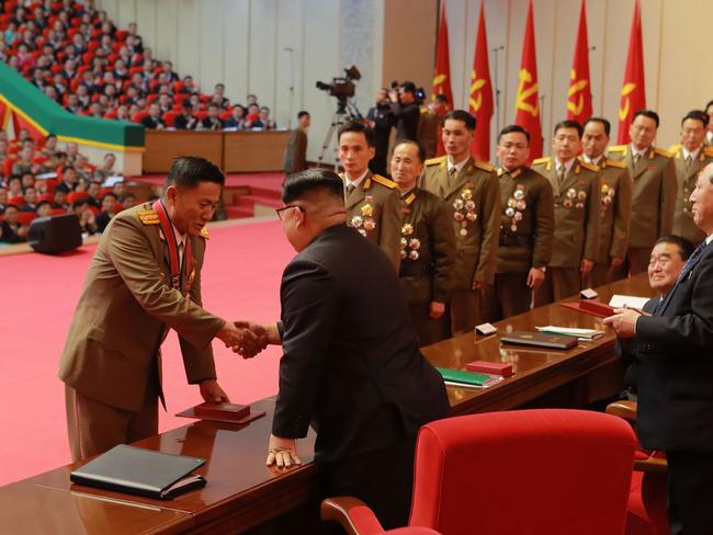 Kim Jong-un awards scientists in the field of national defence for their success in the Hwasong-15 ICBM test launch. Picture: KCNA/AFP