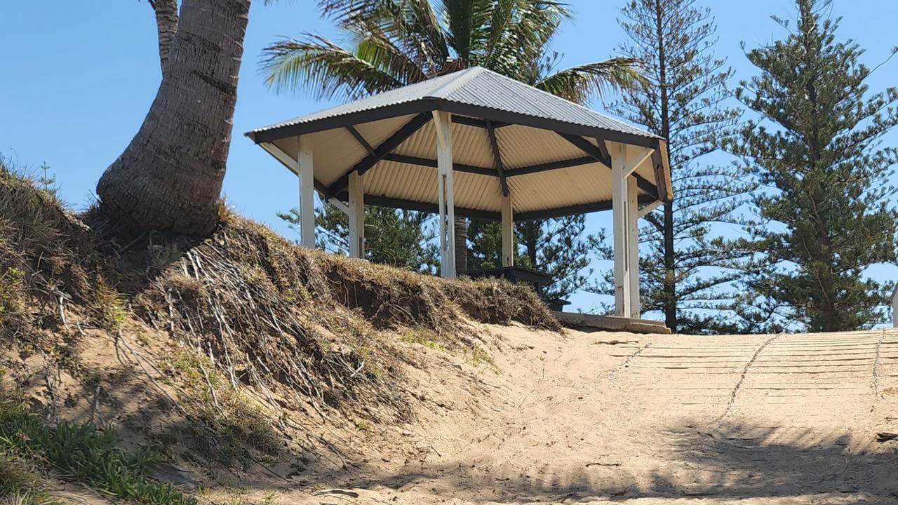 Palm trees including this one (left), near the beach access ramp at Emu Park Main Beach, are at risk of toppling over due to erosion. Photo: Darryn Nufer.