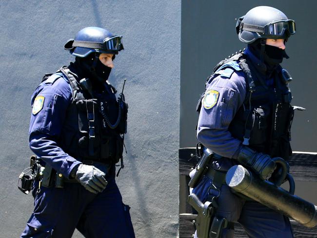 Officers move in during an operation by the Middle East Organised Crime Squad in western Sydney. File picture