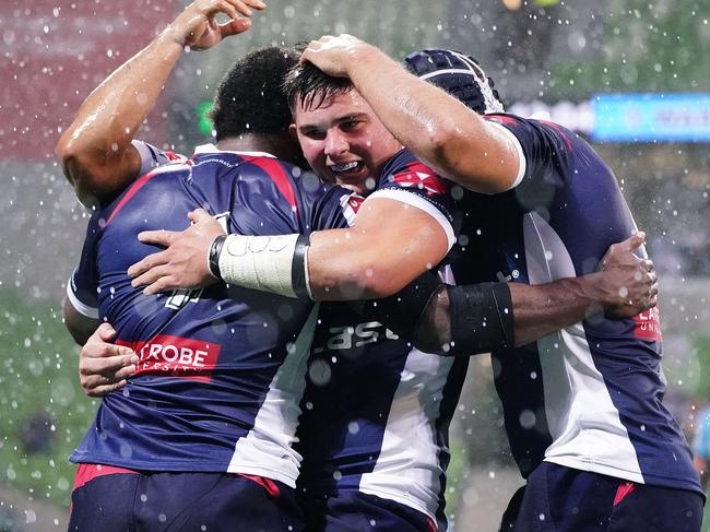 Rebels players celebrate after a try scored by Marika Koroibete during the Round 3 Super Rugby match between the Melbourne Rebels and NSW Waratahs at AAMI Park in Melbourne, Friday, February 14, 2020. (AAP Image/Scott Barbour) NO ARCHIVING, EDITORIAL USE ONLY