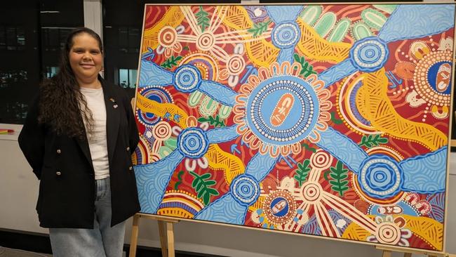 Straddie artist Leah Cummins with some of her designs which will be part of an online collection ahead of NAIDOC Week. Picture: Contributed