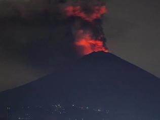 A red glow can be seen on Mt Agung