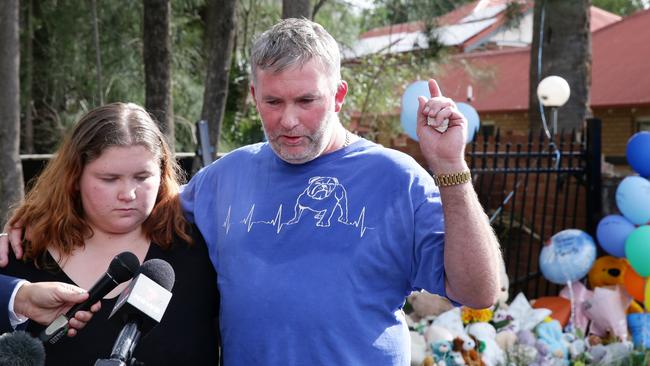 Joseph Shorey with his daughter Shanice Shorey at the memorial. Picture: Jonathan Ng