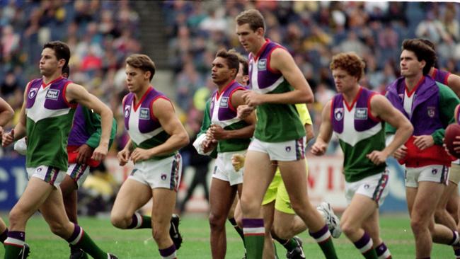 Fremantle warming up before their first AFL game in 1995. Picture: Matthew Bouwmeester.