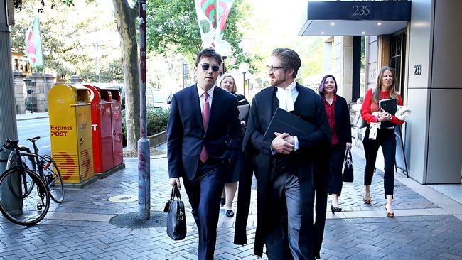 Journalist Joe Aston leaving Federal court with his lawyer in the defamation trial against Elaine Stead. Picture: Jane Dempster