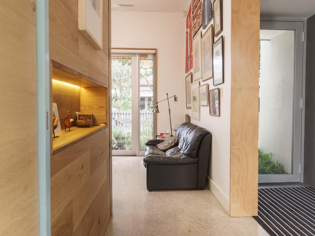 With bespoke oak timber-lined hallways disguising secret doors, wine storage and cupboards. Photo: Nick Clayton.