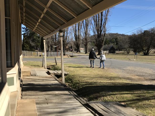 Ava and Evie Maguire walk down the main street of Hill End, NSW. Picture: Mercedes Maguire