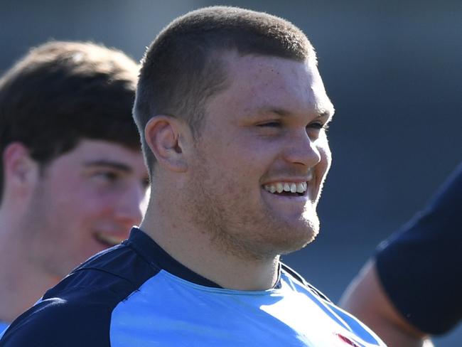 Tom Robertson of the Waratahs gestures as he stands with his teammates during a training session in Sydney, Tuesday, July 10, 2018. (AAP Image/David Moir) NO ARCHIVING