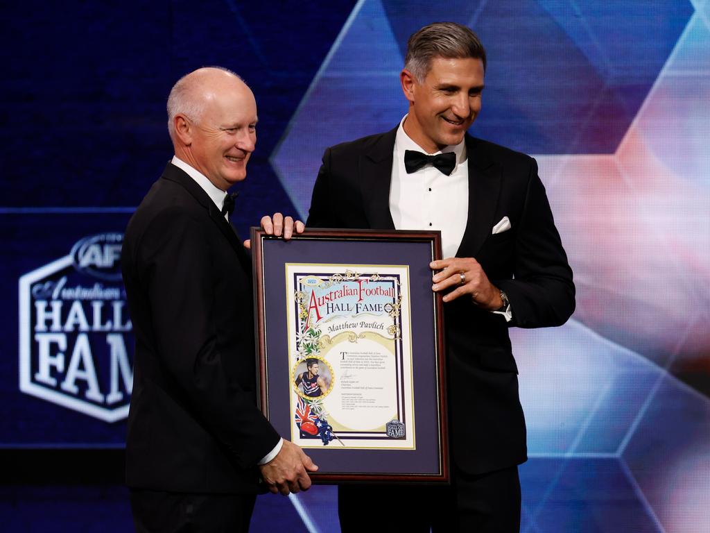 AFL chairman Richard Goyder presents Pavlich with his Hall of Fame plaque. Picture: AFL Photos/Getty Images