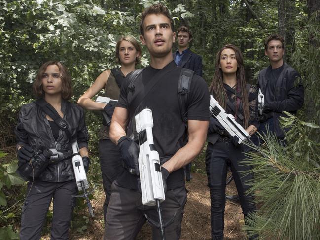 This image released by Lionsgate shows from left, Zoe Kravitz, Shailene Woodley, Theo James, Ansel Elgort, Maggie Q and Miles Teller in a scene from "The Divergent Series: Allegiant." (Murray Close/Lionsgate via AP)