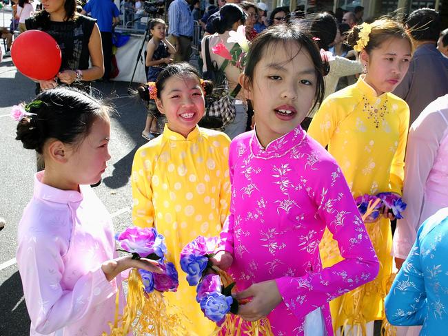 Dancing girls get ready to go on stage at the Cabramatta moon festival in 2005. Picture: James Horan