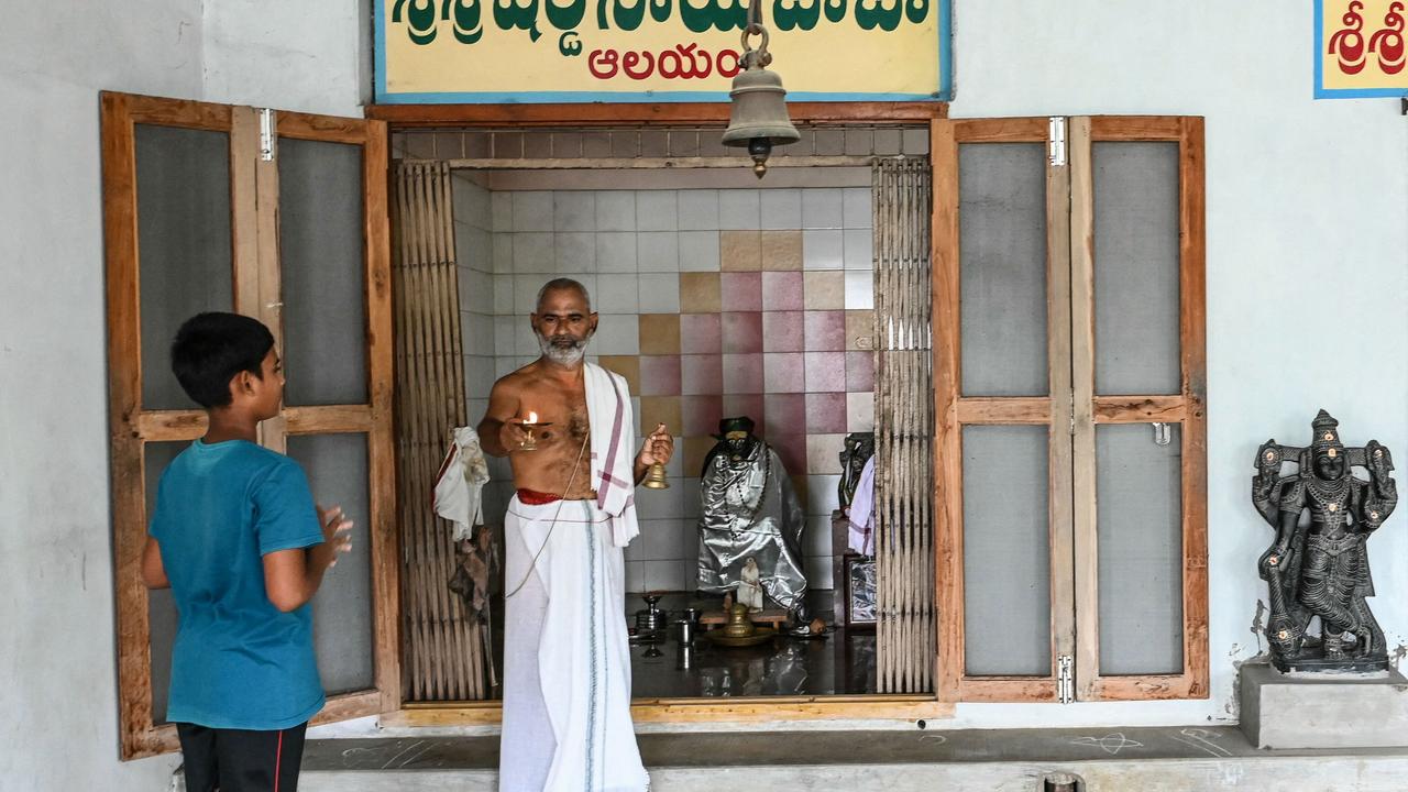 Hindu priest Subhramanya Sharma prays for the victory of Usha Vance's husband JD Vance at a Sai Baba temple in Vadluru, ancestral village of Usha's parents at the West Godavari district of India's Andhra Pradesh state. Picture: AFP