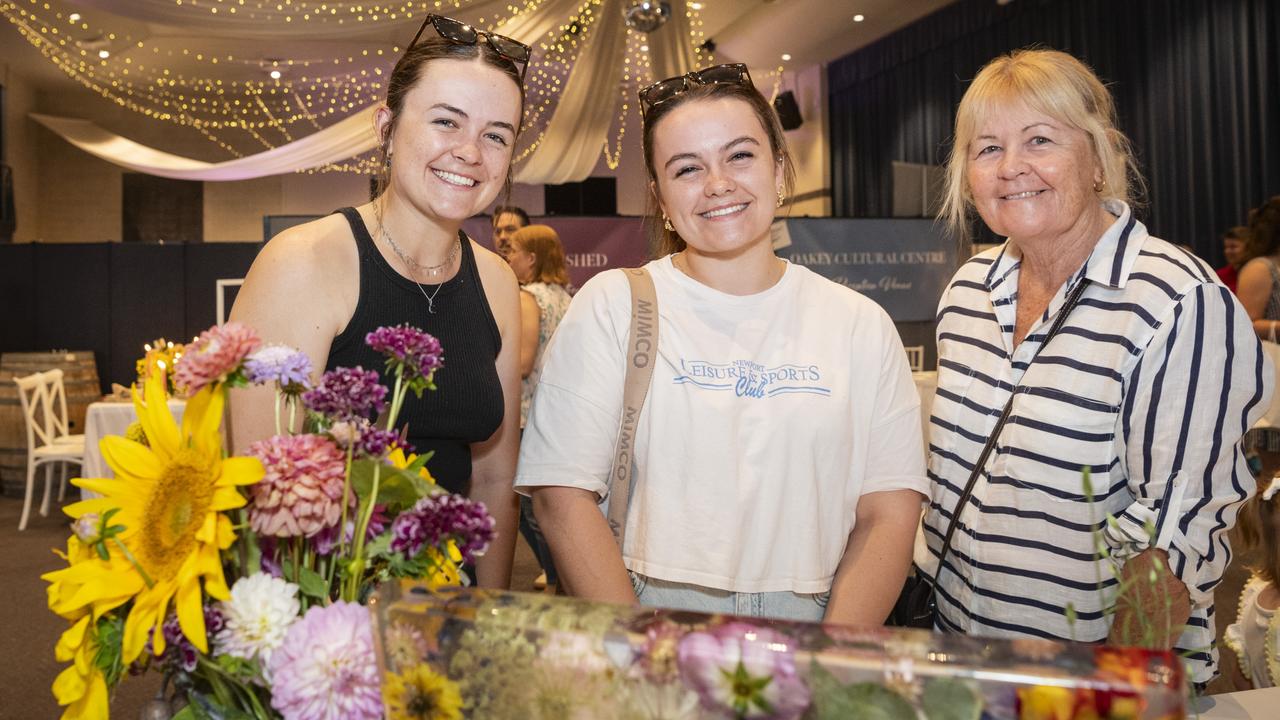 Admiring the Meadows by the Sea display are (from left) Piper Warren, bride-to-be Kobey Warren and Jo Warren at Toowoomba's Wedding Expo hosted by Highfields Cultural Centre, Sunday, January 21, 2024. Picture: Kevin Farmer