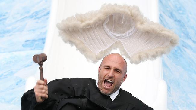 Chris Judd comes down the slide as Judge Juddy. Picture: Michael Klein