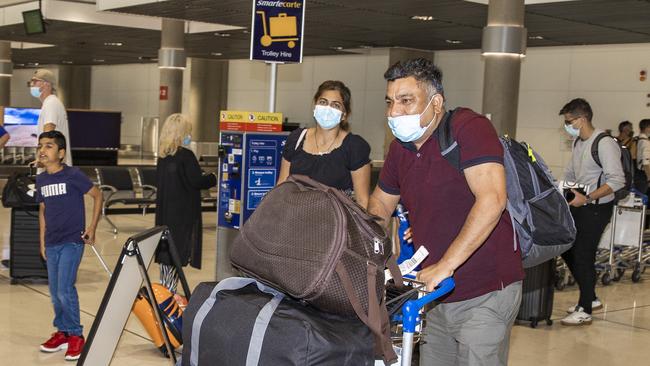 Kartik Singla (far left), Harwinder Kaur and Satish Kumar have moved from Sydney to Brisbane. Picture: Nigel Hallett