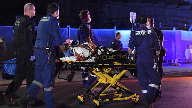 Paramedics treated the 22-year-old before taking him to hospital. Picture: Gordon McComiskie