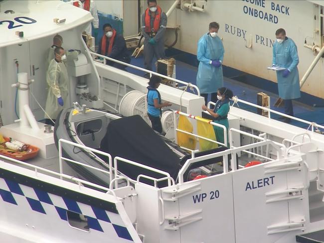 An unwell crew member on the notorious Ruby Princess is taken off the ship yesterday. Picture: 7 News