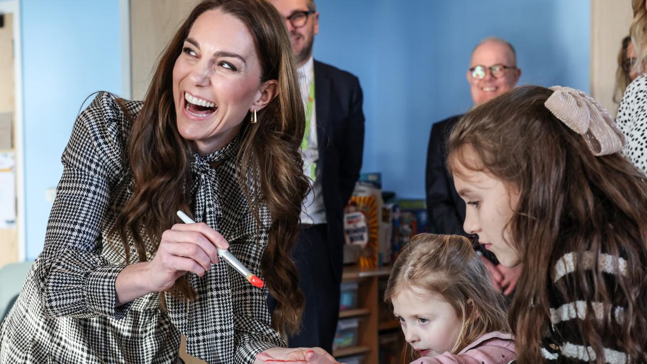 Adorable moment Kate plays with brave kids